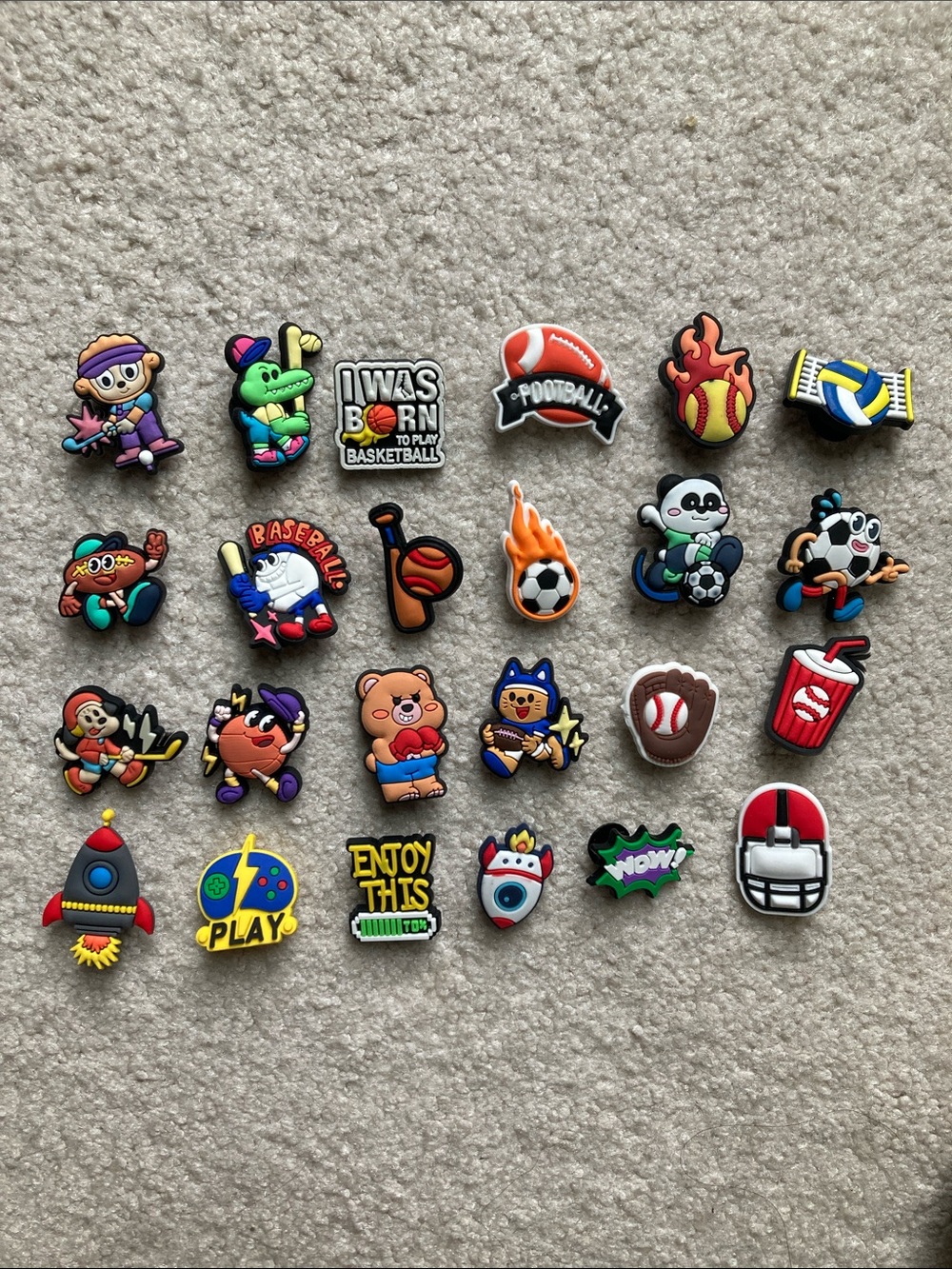 Set of 24 mainly sports themed shoe charms